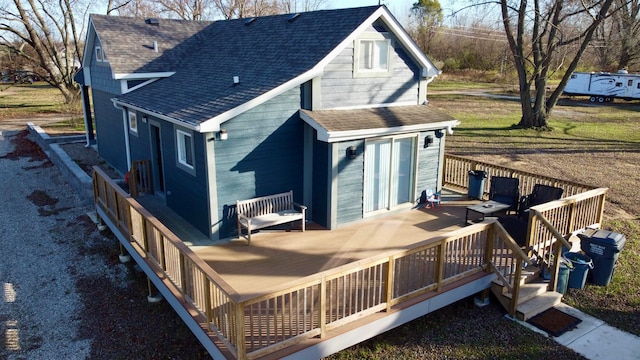 back of house with a wooden deck