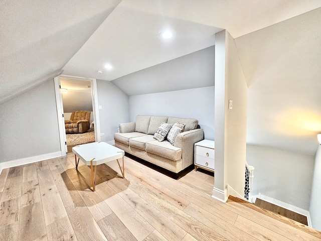 interior space featuring vaulted ceiling and light hardwood / wood-style flooring