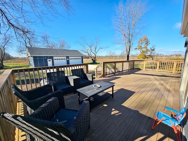 wooden terrace featuring an outdoor living space, a garage, and an outdoor structure