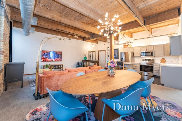 carpeted dining area featuring beamed ceiling, a notable chandelier, and wooden ceiling