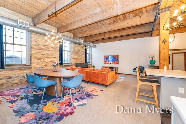 dining space featuring wood ceiling, brick wall, beam ceiling, a notable chandelier, and a wood stove