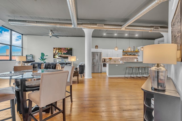 dining room featuring ceiling fan and light hardwood / wood-style floors