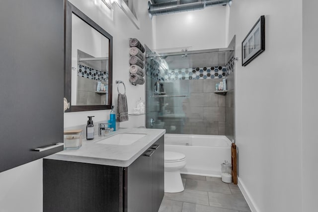 full bathroom with shower / bath combination with glass door, tile patterned flooring, vanity, and toilet