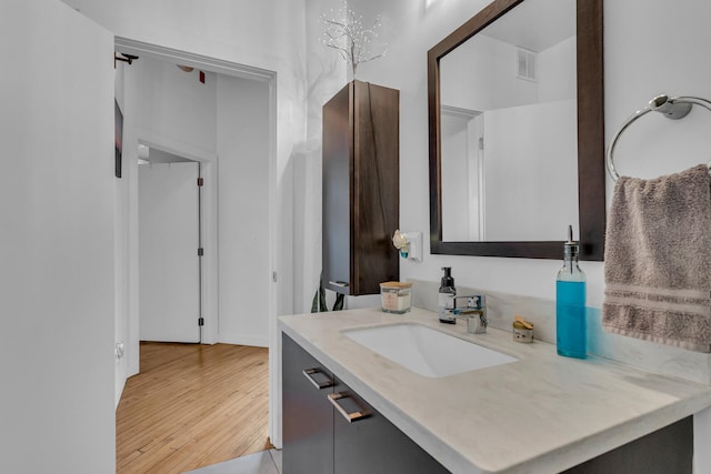 bathroom featuring vanity and hardwood / wood-style flooring