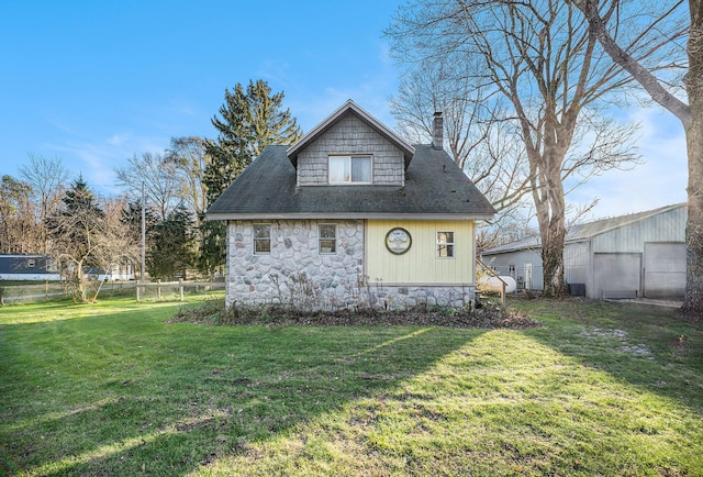 view of home's exterior with a lawn