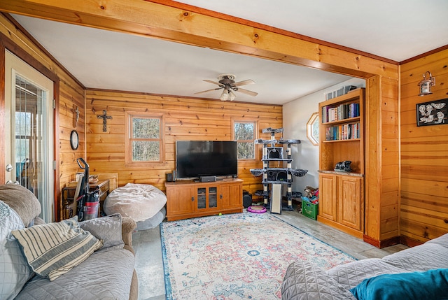 living room featuring ceiling fan and wooden walls