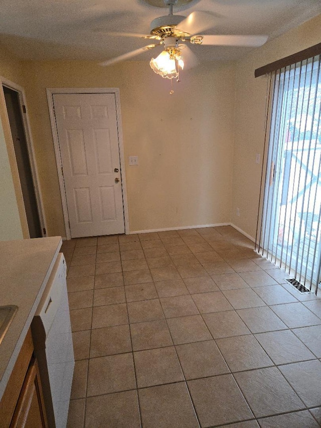 interior space featuring ceiling fan