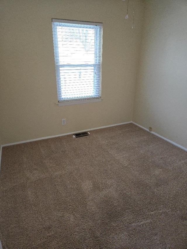 empty room with carpet flooring