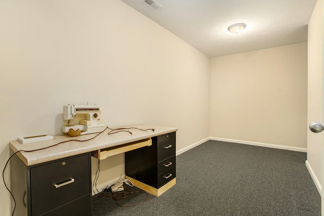 unfurnished office featuring dark colored carpet