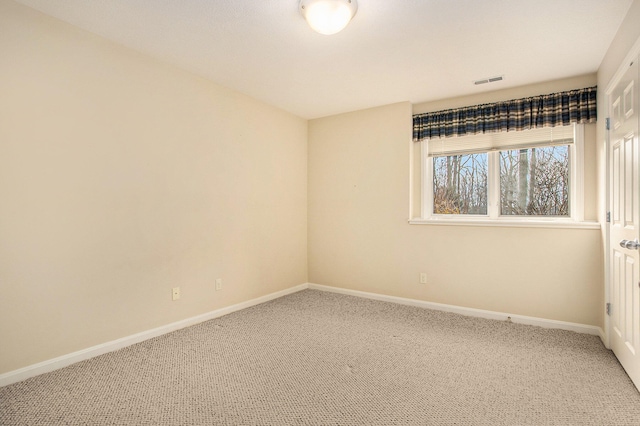 spare room featuring carpet floors