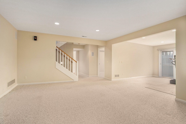 spare room with light colored carpet