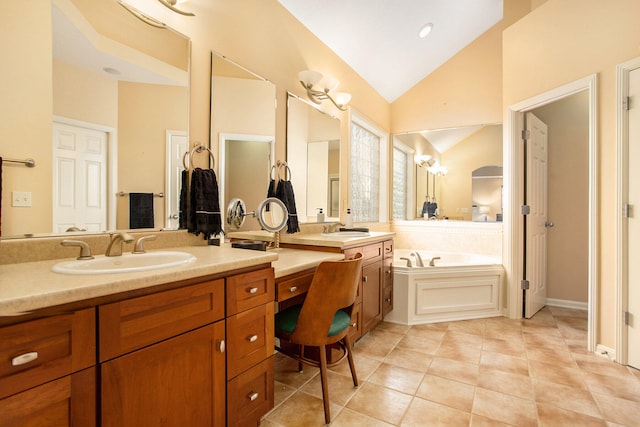 bathroom featuring vanity, a tub to relax in, tile patterned floors, and high vaulted ceiling