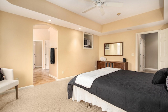 bedroom featuring ceiling fan and light colored carpet