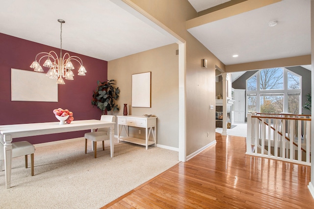 dining room featuring hardwood / wood-style flooring and a notable chandelier