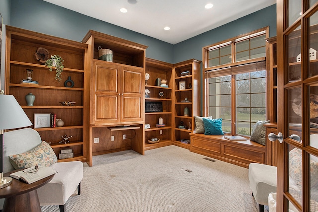 home office featuring french doors and light colored carpet