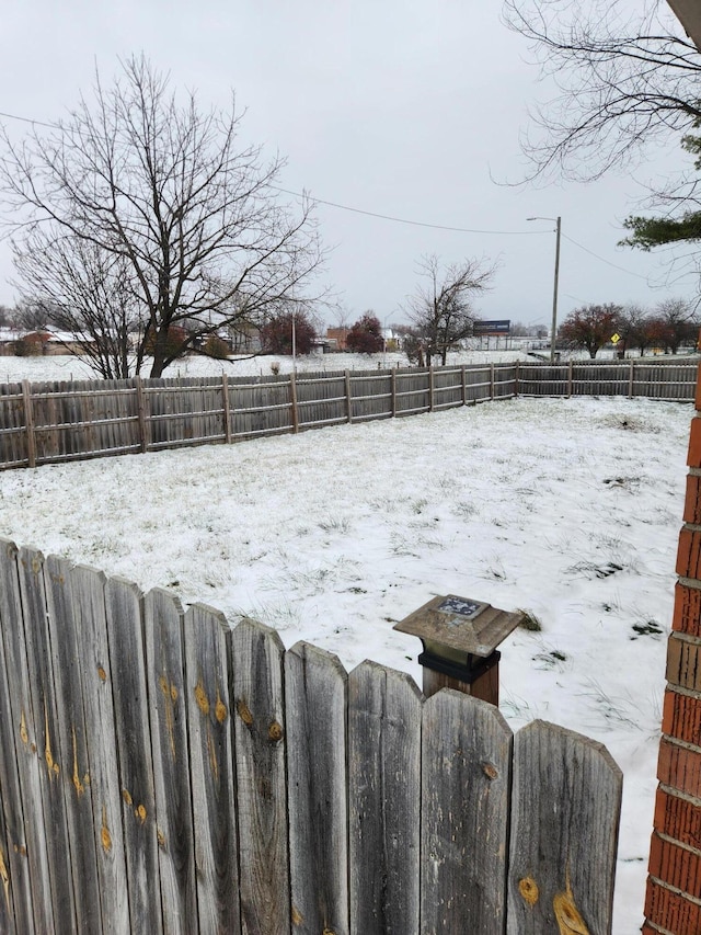 view of yard covered in snow