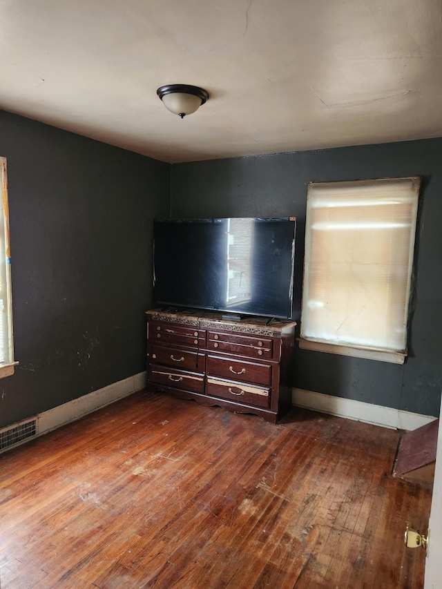 unfurnished bedroom featuring hardwood / wood-style floors