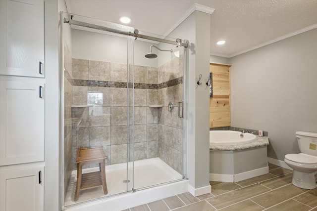 bathroom featuring a textured ceiling, toilet, crown molding, and plus walk in shower