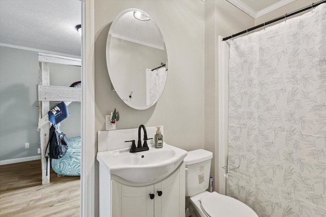 bathroom with toilet, wood-type flooring, ornamental molding, and a textured ceiling