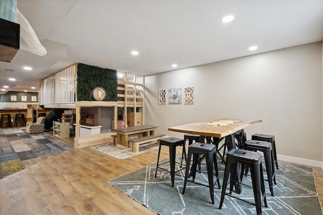 dining space with hardwood / wood-style floors