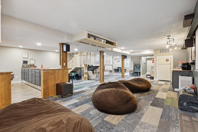 living room featuring a textured ceiling