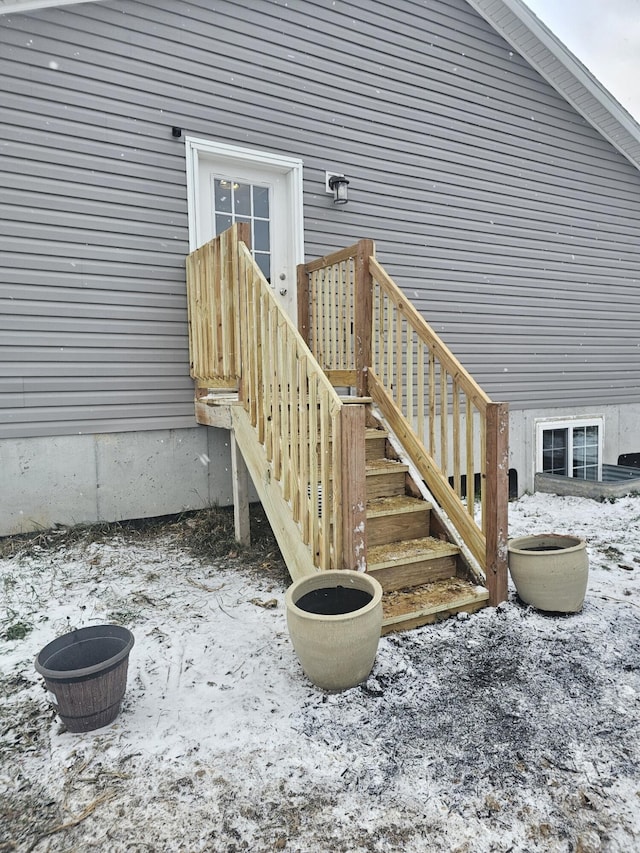 view of snow covered property entrance