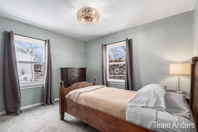 bedroom featuring light carpet