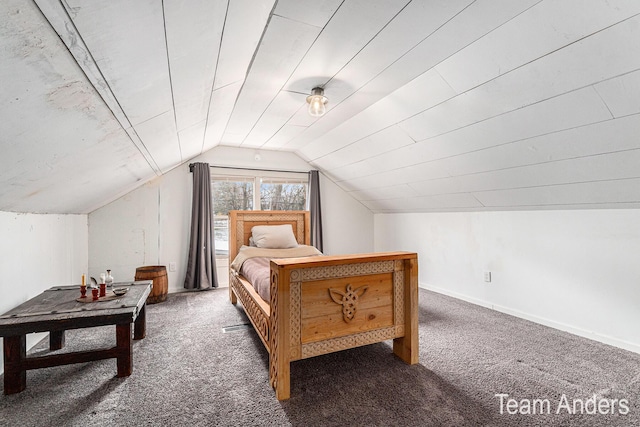 bedroom featuring dark carpet and vaulted ceiling