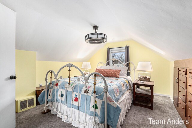 bedroom featuring carpet flooring and vaulted ceiling