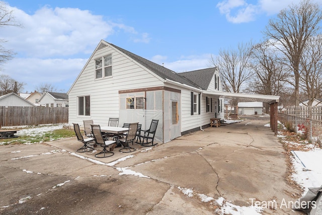 rear view of house featuring a carport