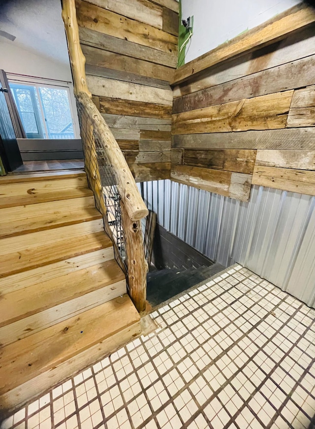 staircase featuring tile patterned flooring