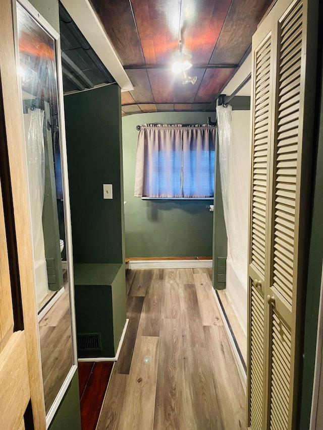 bathroom with wood-type flooring