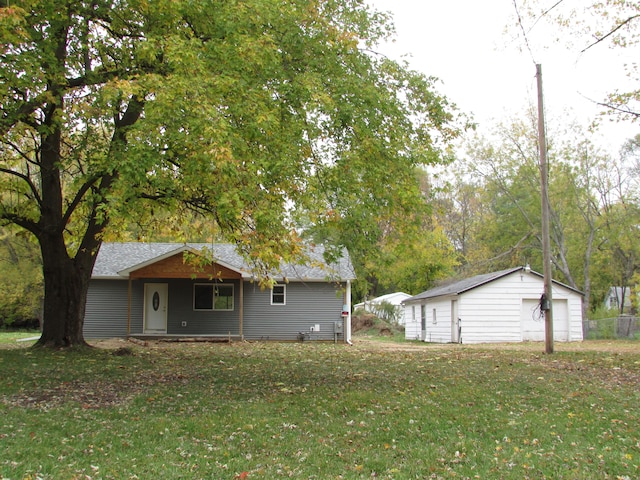 exterior space with a garage and an outdoor structure