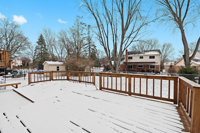 view of snow covered deck