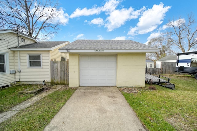 exterior space featuring a lawn and a garage