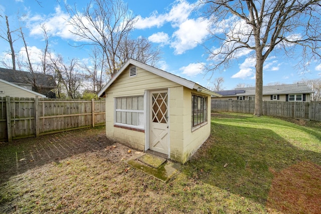 view of outbuilding featuring a yard