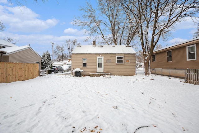 view of snow covered house