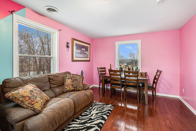 living room featuring dark wood-type flooring