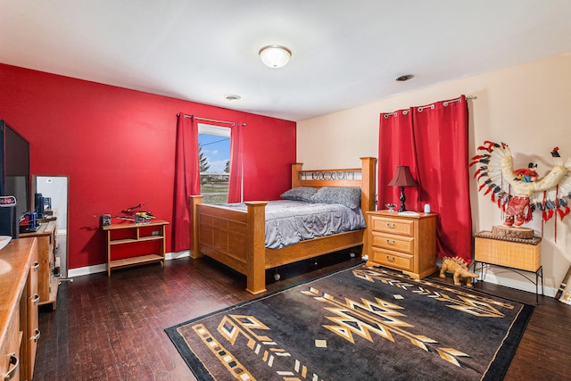 bedroom featuring dark hardwood / wood-style flooring