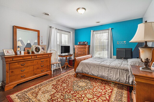 bedroom with hardwood / wood-style floors