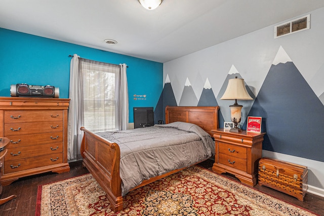 bedroom with dark hardwood / wood-style floors