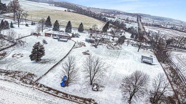 snowy aerial view with a mountain view