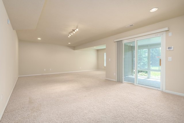 empty room with light colored carpet