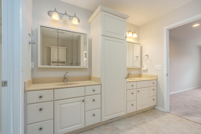 bathroom with tile patterned flooring and vanity