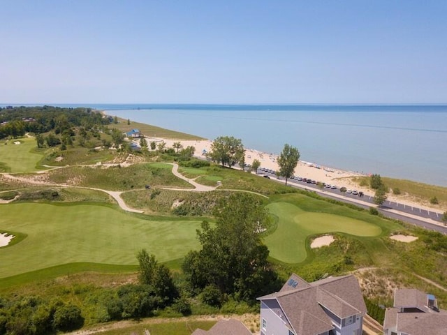 bird's eye view with a water view and golf course view