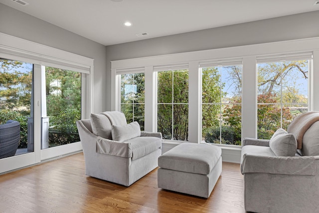 sunroom featuring plenty of natural light and visible vents