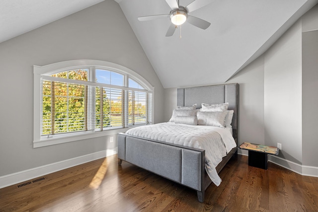 bedroom with visible vents, ceiling fan, vaulted ceiling, wood finished floors, and baseboards