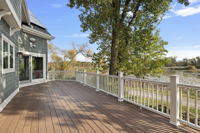 wooden terrace with a water view