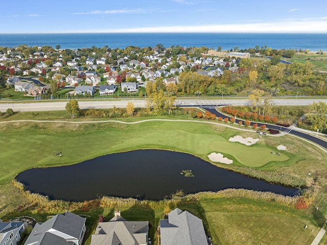 bird's eye view with a residential view, a water view, and golf course view