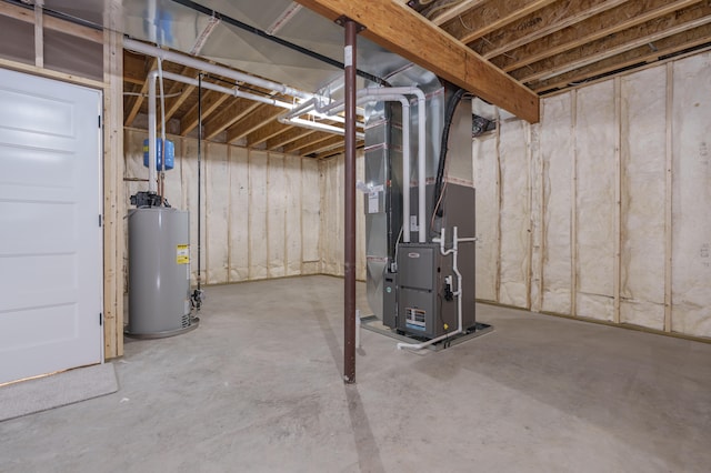 basement featuring gas water heater and heating unit